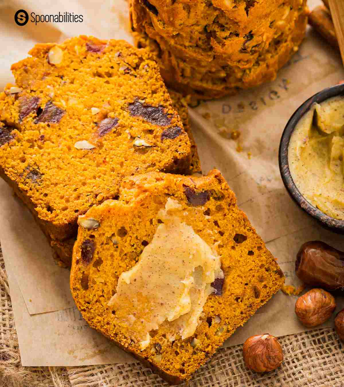 a couple slices pumpkin bread with a smear of brown butter