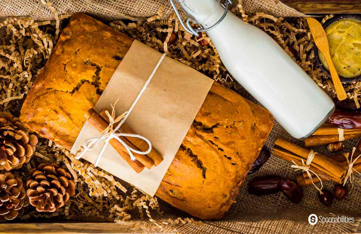 a loaf of pumpkin bread in a decorated gift box