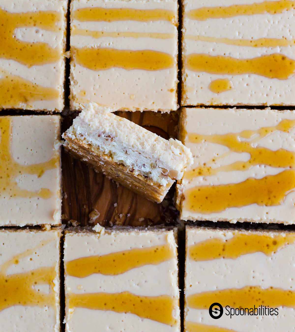 Cheesecake bars with drizzle of bourbon barrel-aged maple syrup