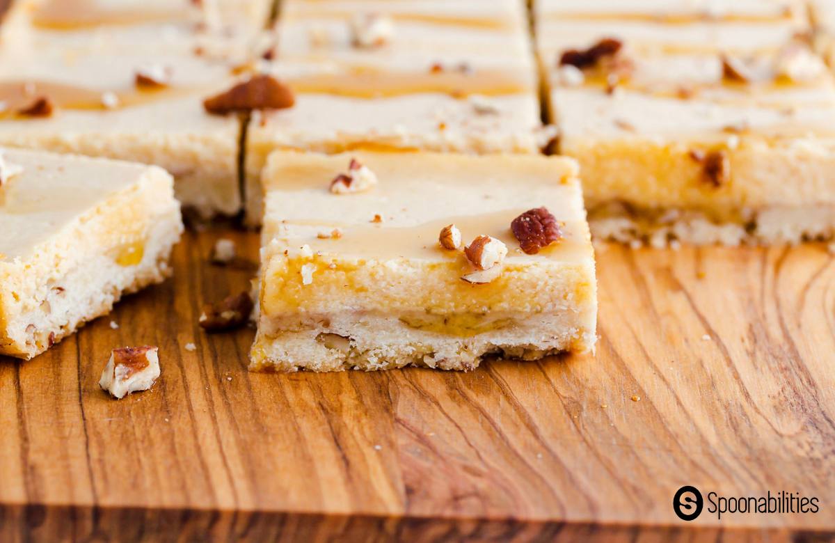 Cheesecake bar squares with crushed pecan on top