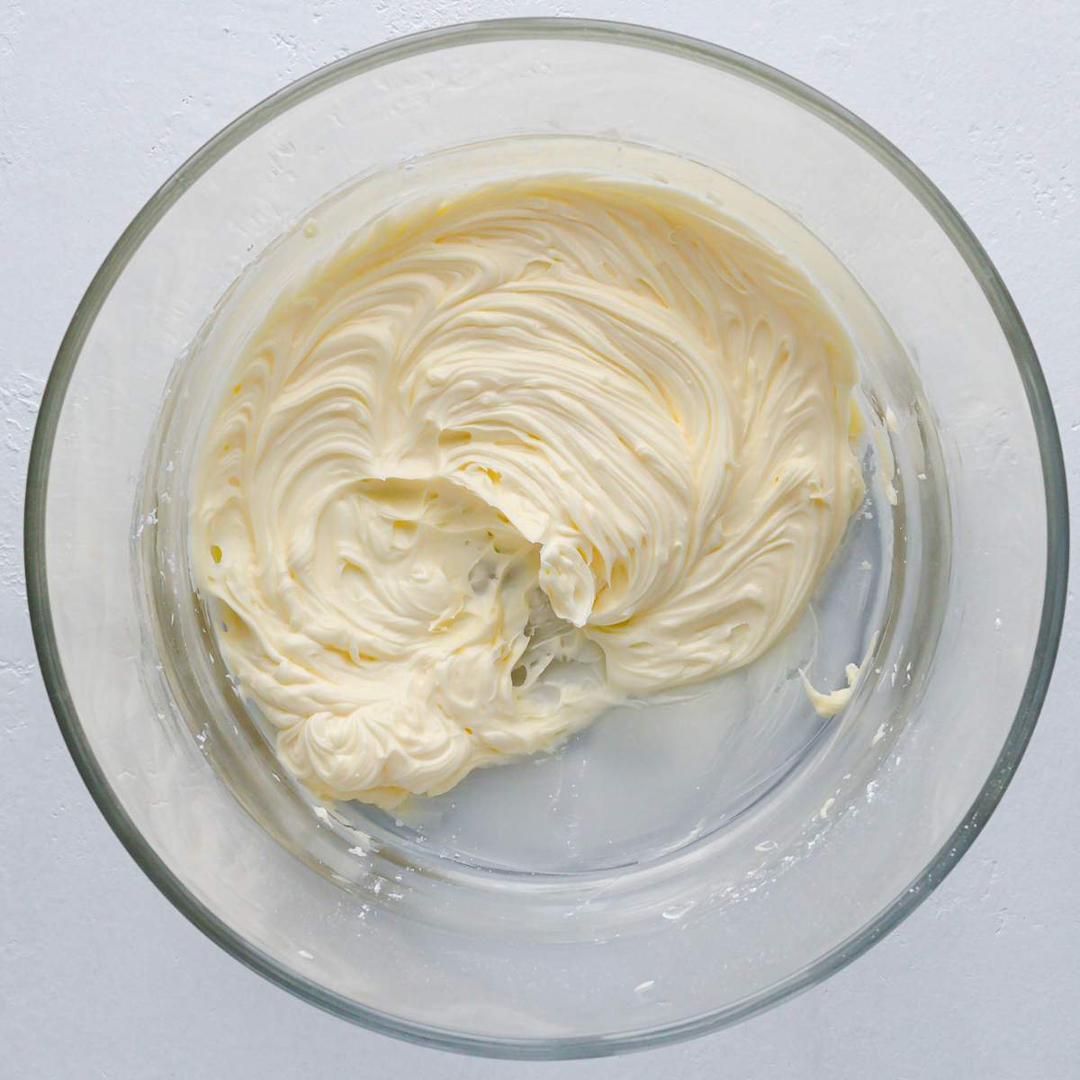 Beaten butter and sugar in a glass bowl