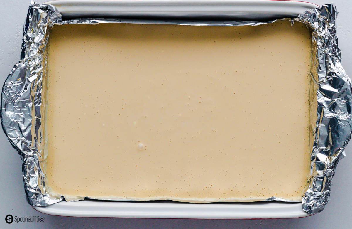 Cheesecake batter in a rectangle baking dish