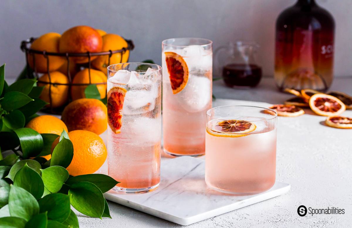 blood orange vodka cocktail in three glasses